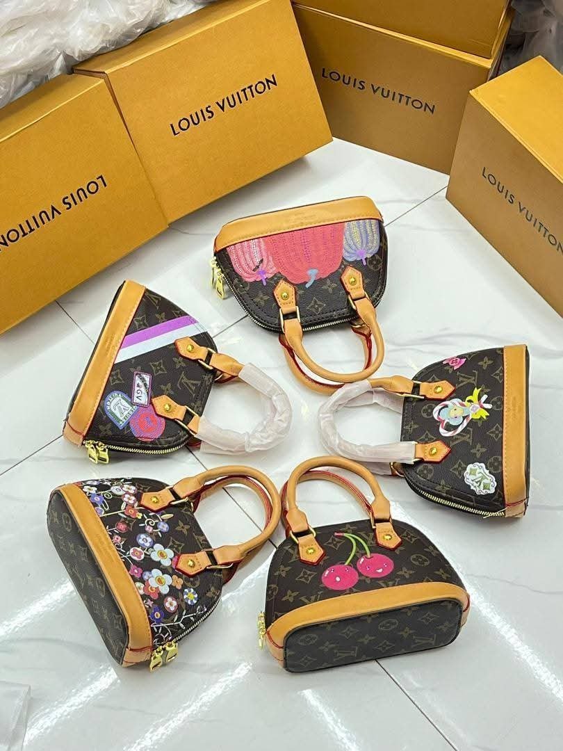 Luxury Louis Vuitton Alma BB Handbag with Graphic Prints